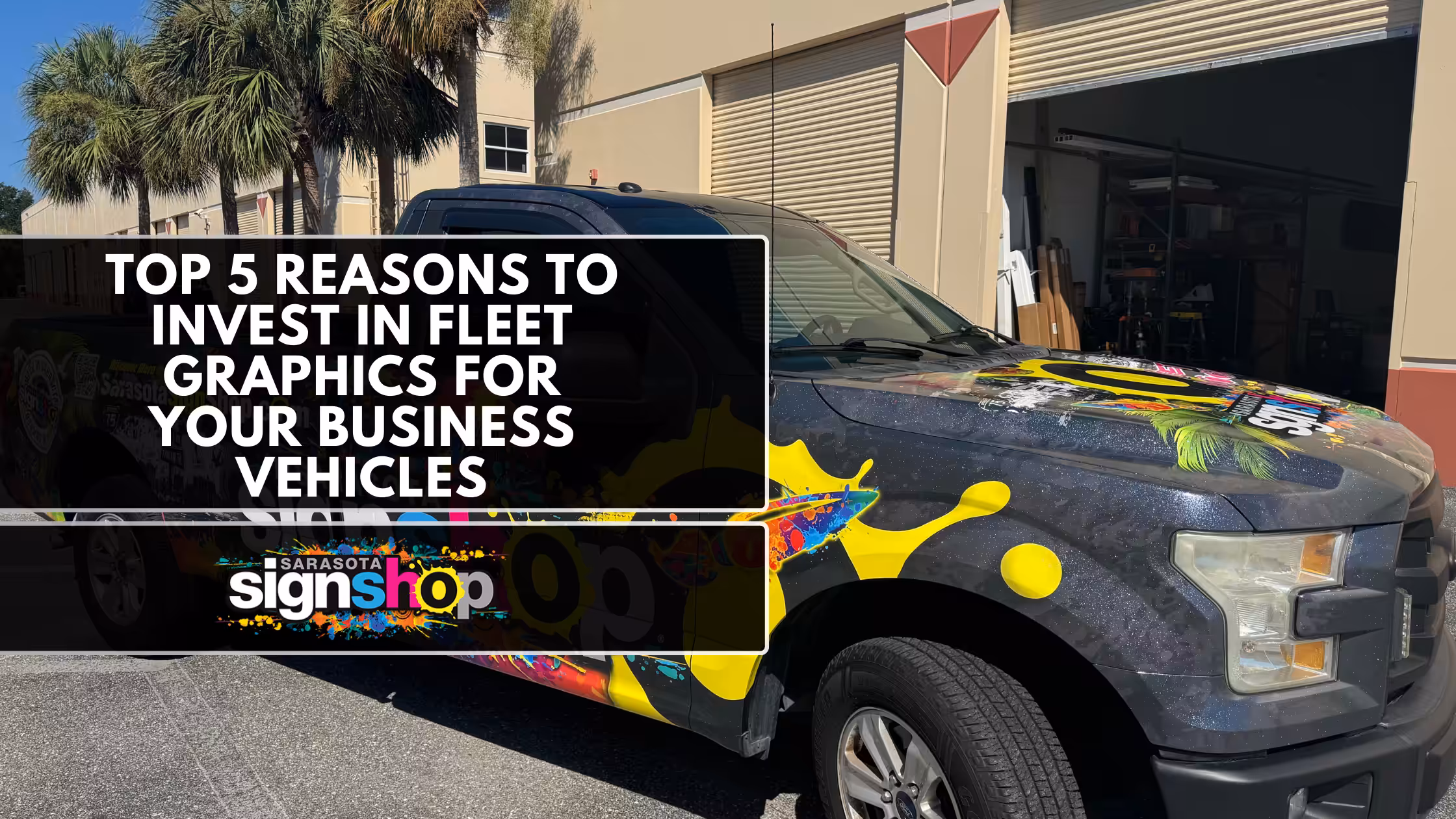 A black pickup truck with colorful graphics parked outside a building. Overlaid text reads: Top 5 Reasons to Invest in Fleet Graphics for Your Business Vehicles. Sarasota Sign Shop logo appears at the bottom.