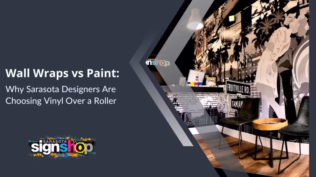 Office with black-and-white vinyl wall wrap, desk, chair, and Wall Wraps vs Paint: Why Sarasota Designers Are Choosing Vinyl Over a Roller text. Sarasota Sign Shop logo at the bottom left.