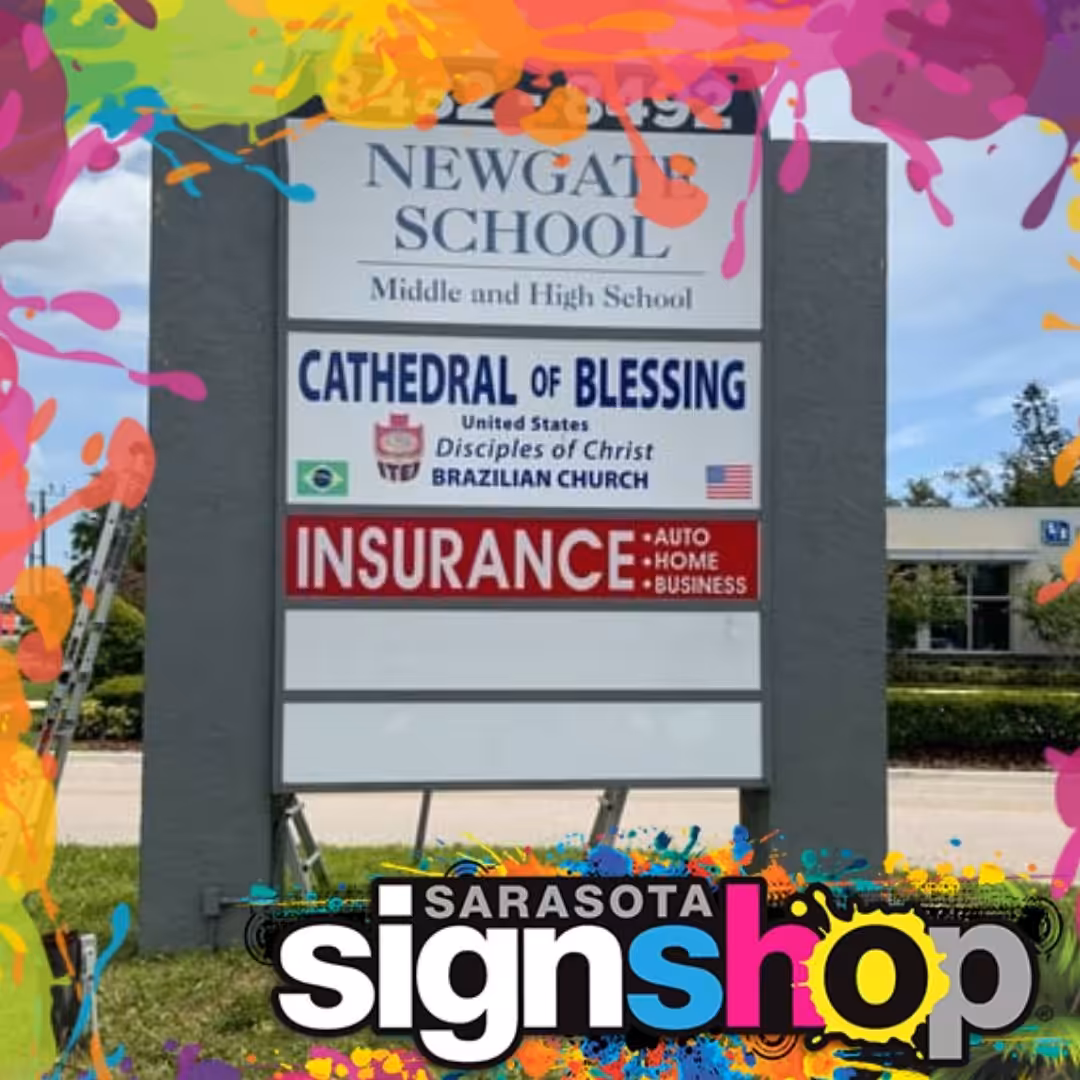 A sign for Newgate School with ads for Cathedral of Blessing and insurance, framed by colorful paint splashes and a Sarasota Sign Shop logo at the bottom, boosts business sign visibility and enhances storefront signs Sarasota.