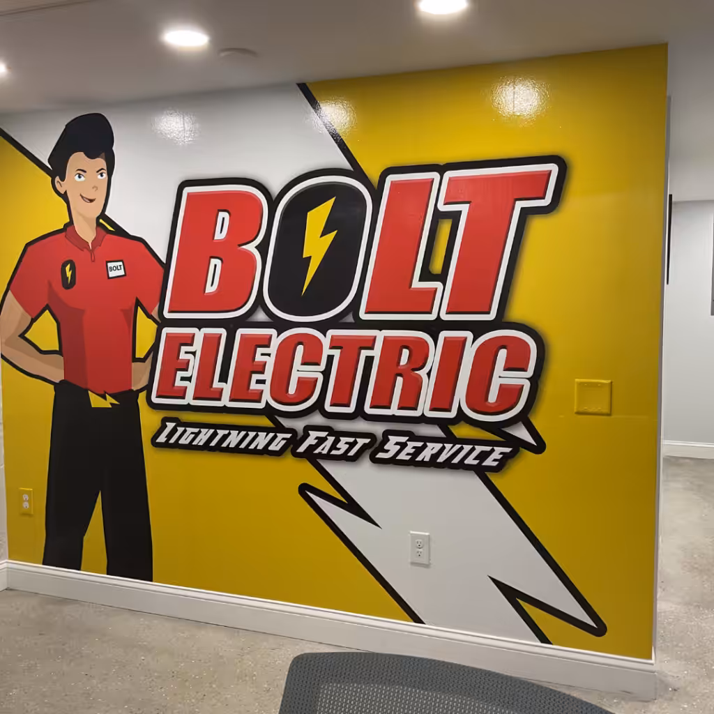 A wall mural, perfect for indoor business signs, shows a cartoon electrician in red beside large text: BOLT ELECTRIC Lightning Fast Service on a yellow background with white lightning graphics.